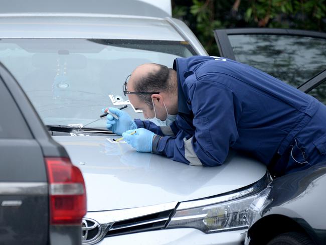 Police at the scene where police shot a person in an alleged stolen car in a McDonalds carpark in Tullamarine. Picture: Andrew Henshaw