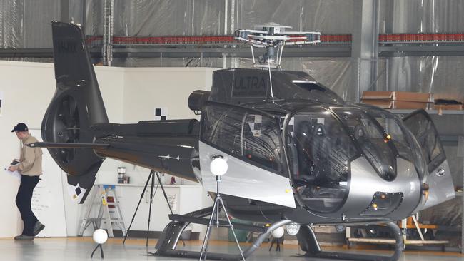 ATSB officers continue their helicopter crash investigations at the Seaworld Helicopter Hangar on the Spit. Picture Glenn Hampson.