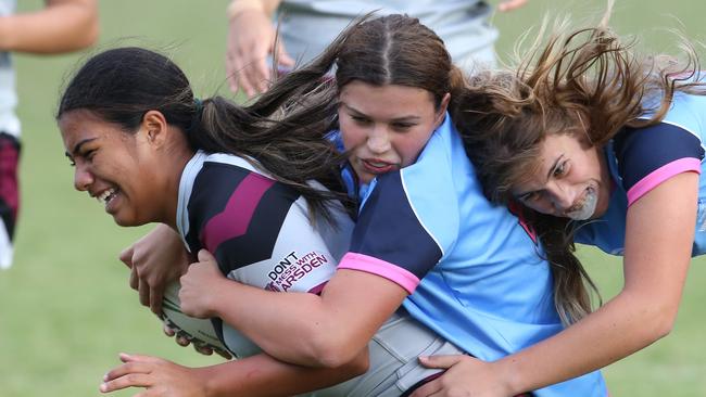 Titans Schools League at Burleigh Bears Junior Rugby League. .Year 9/10 Division 1 girls: - Marymount v Marsden.Marymount defence piles on Marsdens Jordis Kelemete. Picture Glenn Hampson
