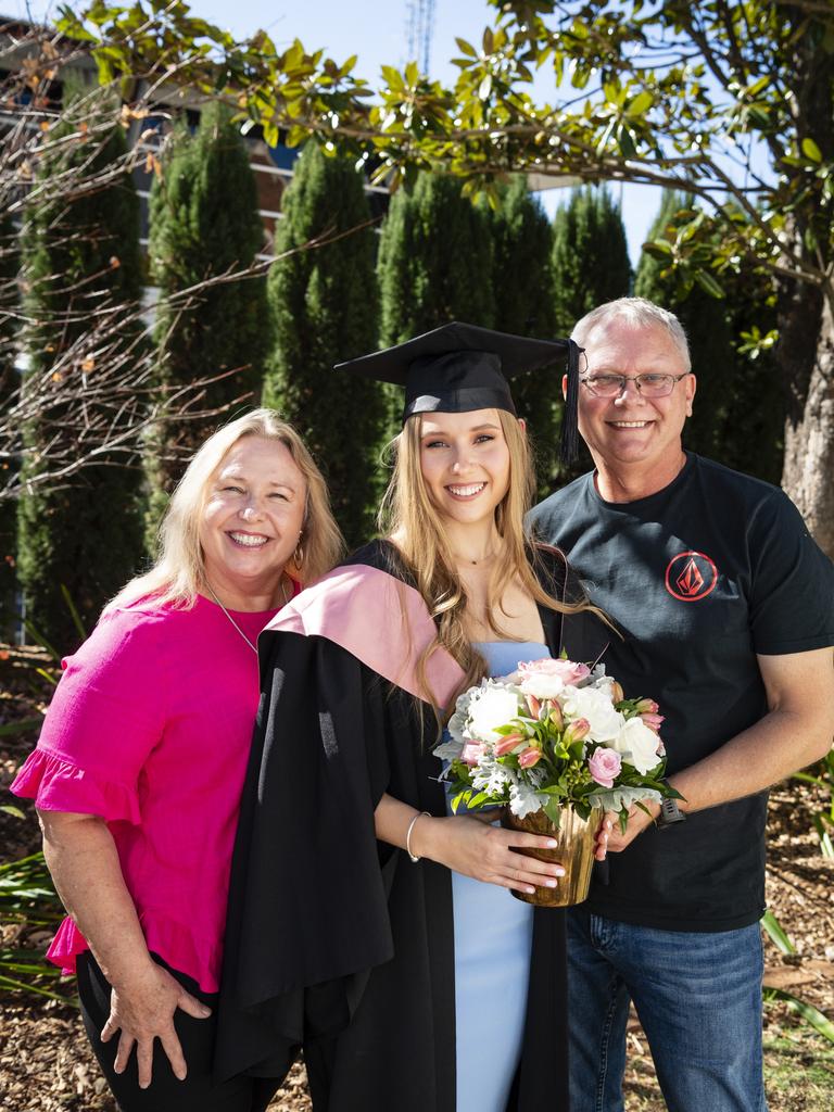 Bachelor of Education (Primary) graduate Beth Curtis is congratulated by parents Helen Proctor-Curtis and Steve Curtis at a UniSQ graduation ceremony at Empire Theatres, Tuesday, June 27, 2023. Picture: Kevin Farmer