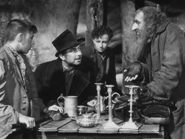 Actor Robert Newton with Alec Guinness and Anthony Newley in 1948 film "Oliver Twist".1940s  /Films/Titles/Oliver/Twist