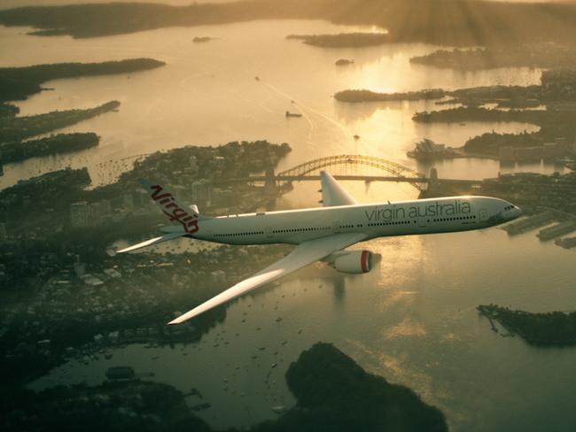 A Virgin Australia plane flying over Sydney Harbour at sunrise. Tourism Australia and Virgin Australia team up to target Americans watching the Oscars. Picture: Supplied