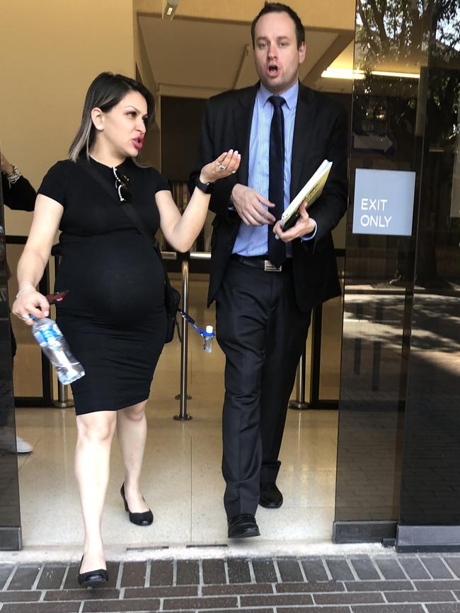 Mohammad Saleh's sister leaves Parramatta Local Court with his barrister Michael Valentin after he was granted bail.