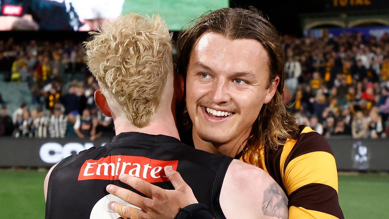 ADELAIDE, AUSTRALIA - APRIL 07: John Noble of the Magpies and Jack Ginnivan of the Hawks embrace during the 2024 AFL Round 04 match between the Collingwood Magpies and the Hawthorn Hawks at Adelaide Oval on April 07, 2024 in Adelaide, Australia. (Photo by Michael Willson/AFL Photos via Getty Images)