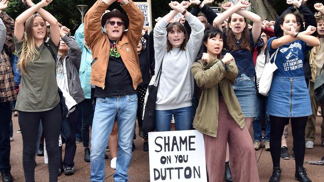 Protesters cross their arms at Hyde Park after marching through the streets of the CBD in Sydney. Picture: Troy Snook