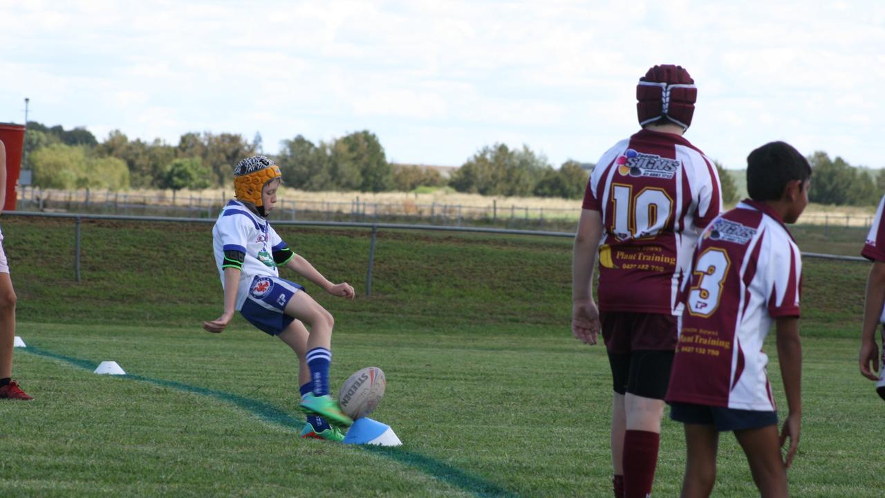 Lucas Bradfield kicks for Collegians against Suburbs in under-10 rugby league. Photo Deanna Millard/Warwick Daily News.