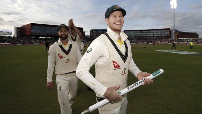 Steve Smith celebrates after Australia claimed victory to retain the Ashes.