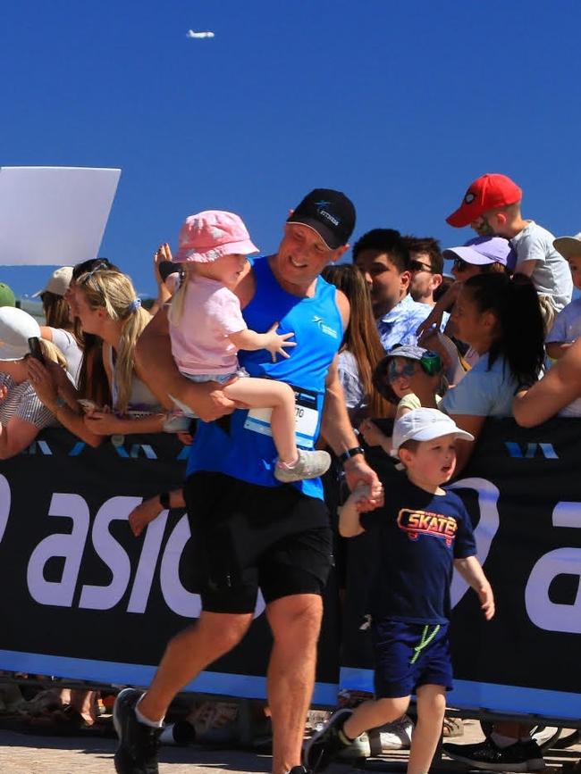 Joel Chant with his kids at the end of the Sydney Marathon earlier this year. Picture: supplied.