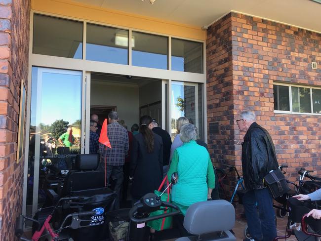 Residents and family from Earle Haven retirement village pack into the auditorium for a meeting about abrupt closure of the nursing home wing.