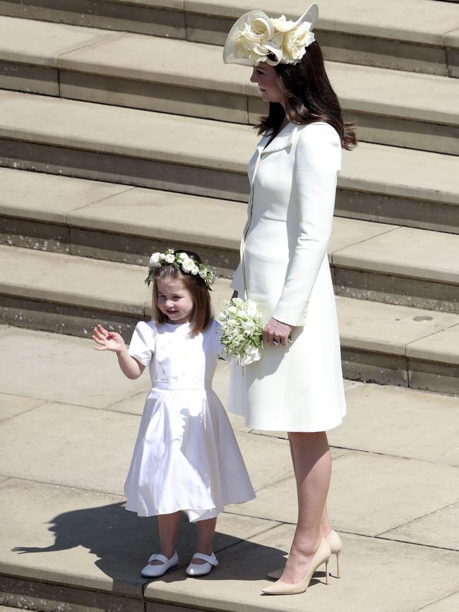 Kate, the Duchess of Cambridge, and Princess Charlotte outside the chapel. Picture: AP