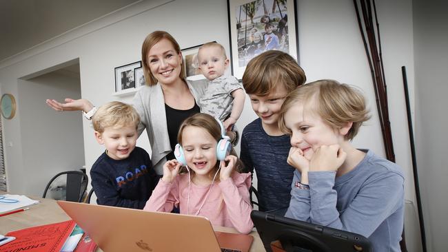 Carly Ravenhall has five children home with home schooling 3 and says it's not a popular opinion, but she is loving it. Carly holding Finn 1 with Noah 3, Lexi 6, Zach 9 and Oscar 8. Picture: David Caird