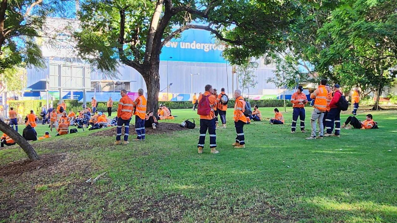 Workers outside the Roma Street Cross River Rail site early on Tuesday morning. Picture: Richard Walker