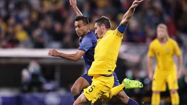 Mark Milligan strikes for goal during his last international for the Socceroos against Nepal.