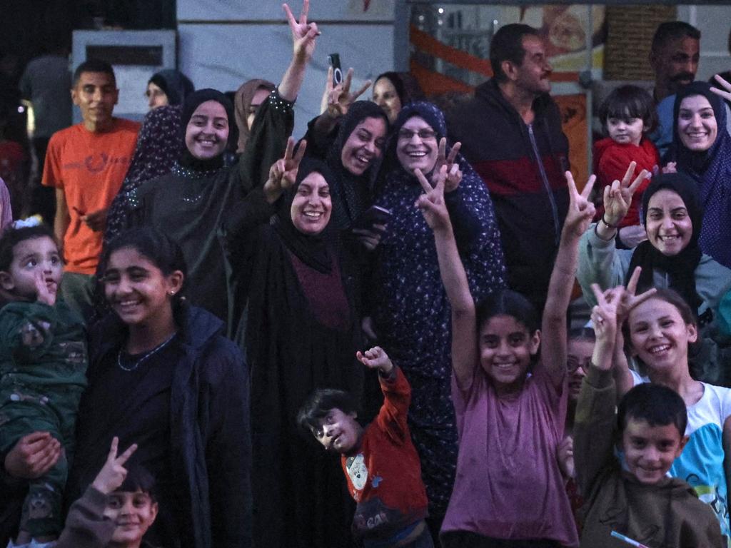 Palestinians celebrate in a street in Rafah, in the southern Gaza Strip, after Hamas announced it has accepted a truce proposal. Picture: AFP