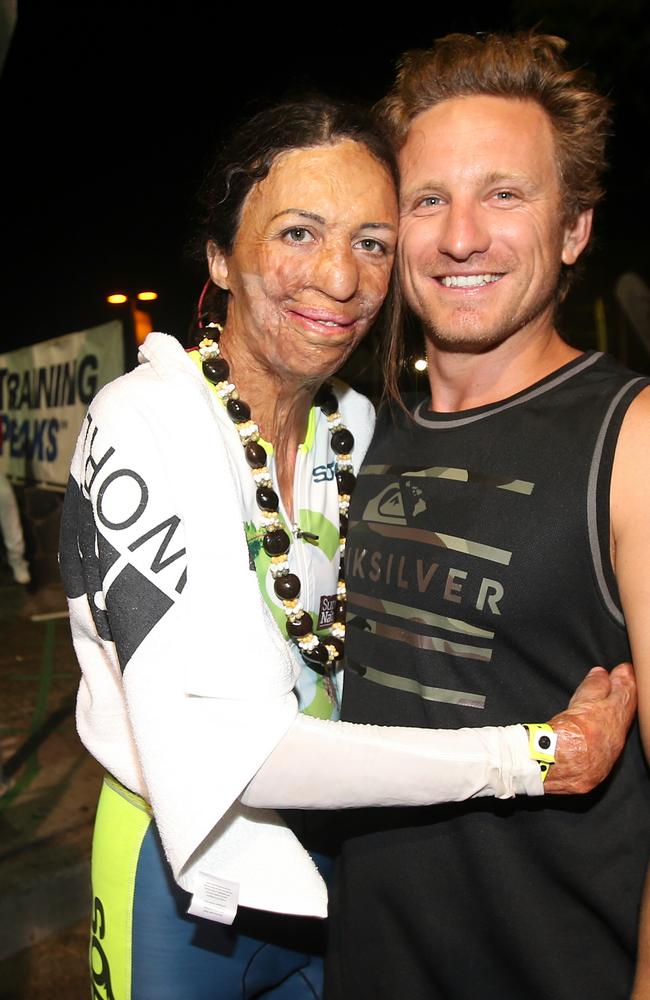 Turia Pitt hugs her partner Michael Hoskin after finish. Pic: Michael Klein