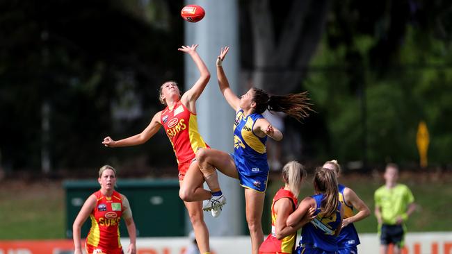 Taylor Smith of the Suns and Parris Laurie of the Eagles contest the ball during the Round 6 AFLW match between the West Coast Eagles and Gold Coast Suns at Mineral Resources Park in Perth, Sunday, March 14, 2020. (AAP Image/Richard Wainwright)