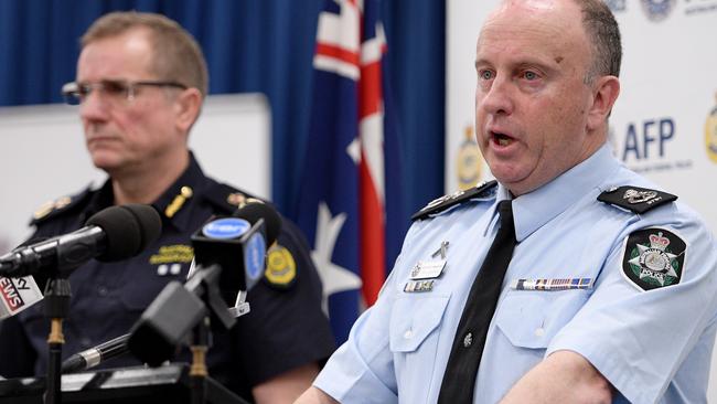 Australian Federal Police (AFP) Assistant Commissioner Neil Gaughan announces the major raids.