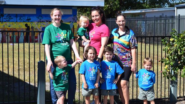 Michaela Wenman with Finn, Marion Mackenzie with Leo and Arlie and Stacey Prenter with Lachlan and William in front of the newly repaired fence.