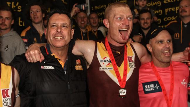 Clark, left, is now a three-time premiership coach. Picture: Davis Harrigan