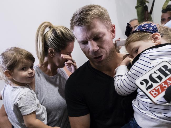 Candice wipes back tears as the family push past waiting media last night. Picture: Getty