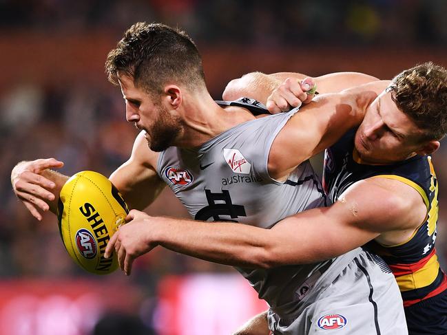 ADELAIDE, AUSTRALIA - MAY 05: Rory Laird of the Adelaide Crows tackles Matthew Wright of the Blues  during the round seven AFL match between the Adelaide Crows and the Carlton Blues at Adelaide Oval on May 5, 2018 in Adelaide, Australia.  (Photo by Mark Brake/Getty Images) *** BESTPIX ***