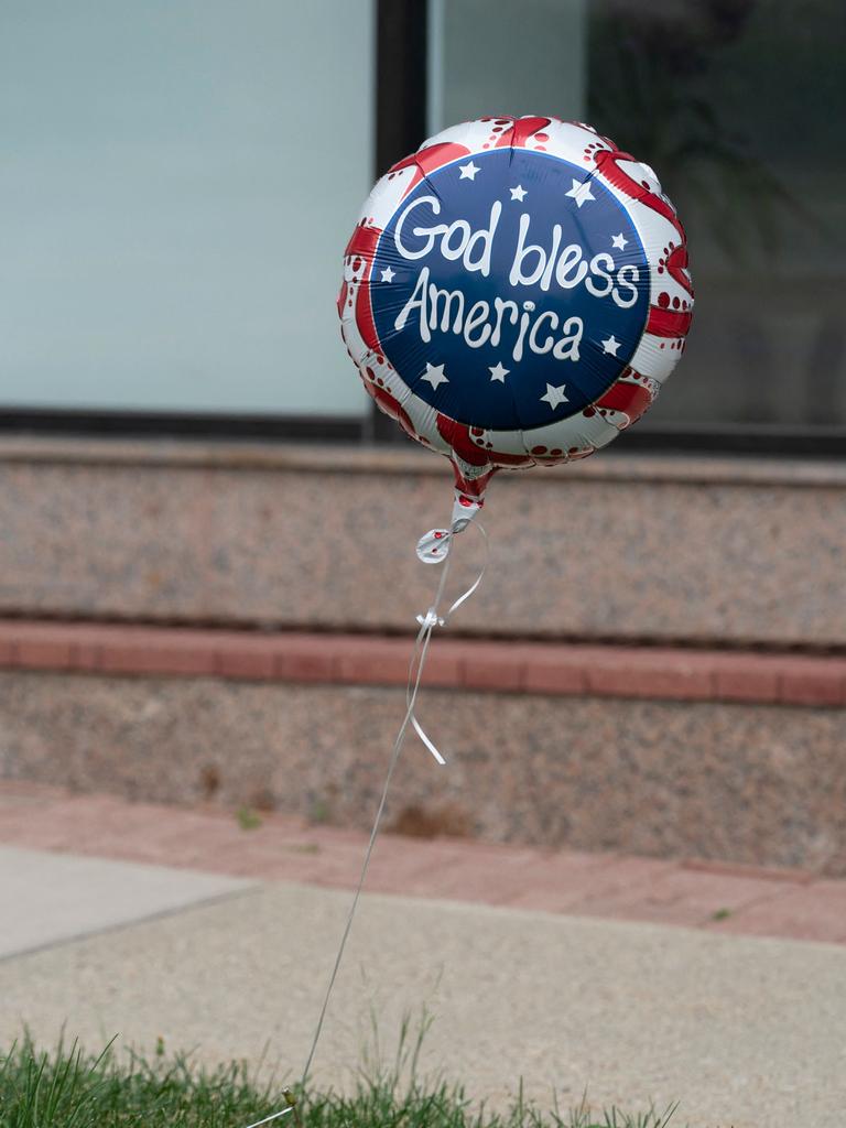 An Independence Day balloon with the words "God Bless America" is seen along the parade route at the scene. Picture: Youngrae Kim / AFP