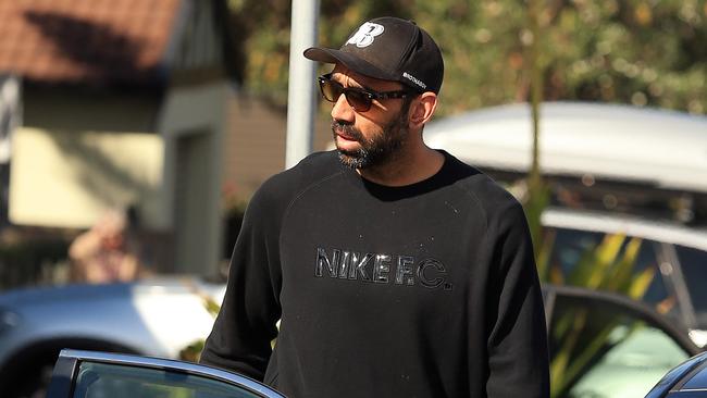 Sydney Swans star player Adam Goodes pictured leaving his North Bondi home today after taking a few days off training. Pictured allegedly swearing at a Ch7 camera man.