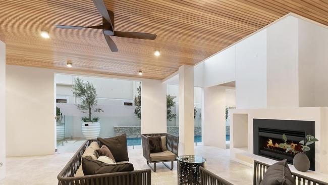 The upper terrace, poolside entertaining with fireplace at 109A Anthony Street, Ascot