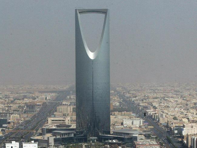 FILE- In this Monday, Oct. 6, 2003 file photo, Saudi Arabian capital Riyadh with the 'Kingdom Tower' photographed through a window of the 'Al-Faislia Tower' in the Saudi Arabian capital Riyadh. Saudi Arabia’s stock exchange has opened up to direct foreign investment for the first time. The decision to open up the Tadawul stock exchange on Monday comes at a crucial time for Saudi Arabia, whose revenue has taken a hit from the plunge in oil prices over the past year. The kingdom is the world’s largest exporter of crude. (AP Photo/Markus Schreiber, File)