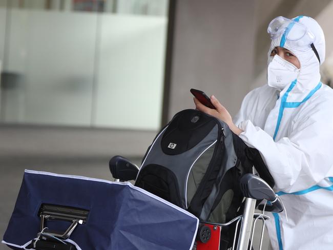 Some people at the Sydney international airport are taking precautions some arenâ€™t.picture John Grainger