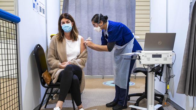 A woman receives a Covid vaccine at a vaccine hub. Picture: Aaron Francis