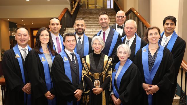 Adelaide City Councillors: Front, Simon Hou, Mary Couros, Alex Hyde, Lord Mayor Sandy Verschoor, Anne Moran, Helen Donovan. Back, Arman Abrahimzadeh, Housman Abiad, Robert Simms, Franz Knoll, Jessy Khera. Far back, Phillip Martin. Picture: AAP / Russell Millard