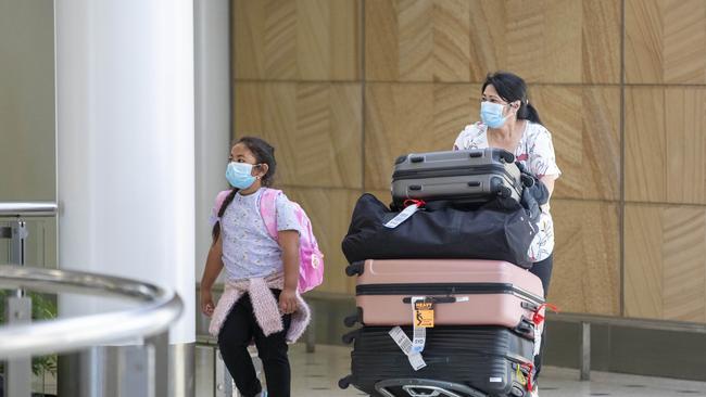 People are seen arriving from a New Zealand flight at Sydney International airport. Picture: NCA NewsWire / Jenny Evans