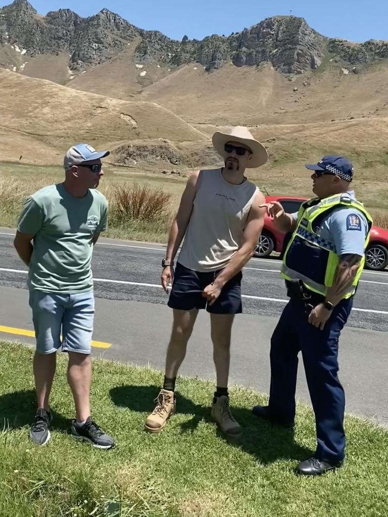 Police were seen speaking to two men who had gathered outside the entrance to the property. Photo: Facebook