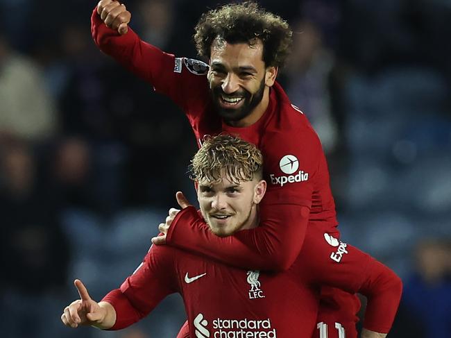 GLASGOW, SCOTLAND - OCTOBER 12: Harvey Elliott of Liverpool celebrates with teammate Mohamed Salah after scoring their team's seventh goal during the UEFA Champions League group A match between Rangers FC and Liverpool FC at Ibrox Stadium on October 12, 2022 in Glasgow, Scotland. (Photo by Ian MacNicol/Getty Images)