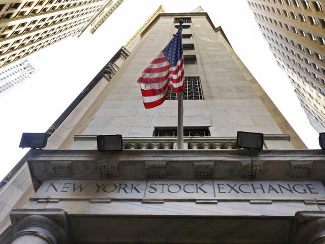 FILE - In this Friday, Nov. 13, 2015, file photo, the American flag flies above the Wall Street entrance to the New York Stock Exchange. Stocks are opening moderately higher on Wall Street on Thursday, June 30, 2016, as traders feel less anxious about Britain's vote a week earlier to leave the European Union. (AP Photo/Richard Drew, File)