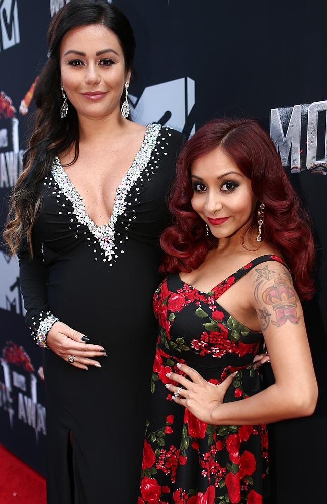 Jennifer 'JWoww' Farley (L) and Nicole 'Snooki' Polizzi attend the 2014 MTV Movie Awards at Nokia Theatre L.A. 