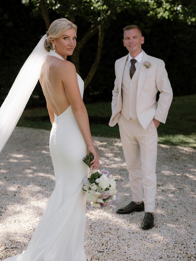 Kah wore an elegant wedding dress and Melham looked sharp in a three-piece suit. Picture: Katie Harmsworth