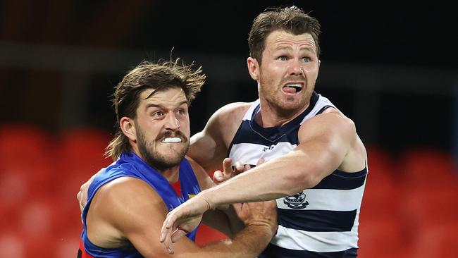 Josh Bruce tangles with Patrick Dangerfield in Round 14.