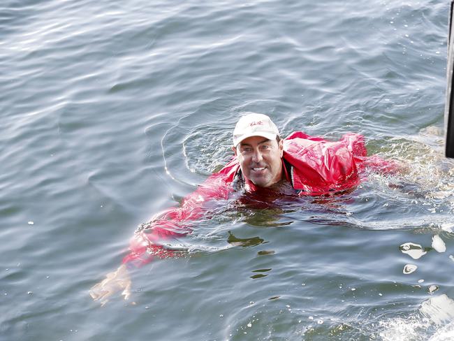Mark Richards is thrown into the Derwent River at Kings pier. Wild Oats XI skippered by Mark Richards sails up the River Derwent on her way to a 9th line honours victory in the 2018 Sydney to Hobart Yacht Race. The yacht crossed the line in 1d 19hrs 7mins 21secs . Picture: RICHARD JUPE