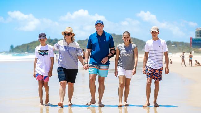 Peter Dutton poses for photos with his family - wife Kirilly with their two sons Harry, 14 (right) and Tom, 13 (left) and daughter Rebecca - during a holiday on the Gold Coast. Picture: Nigel Hallett