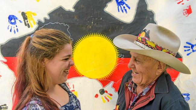 HAPPY CHAT: Nadine Sedger from TAFE Community Services course talks with Gumbaynggir elder John Marshall at last year's Gurehlgam Reconciliation Week event. Picture: Adam Hourigan