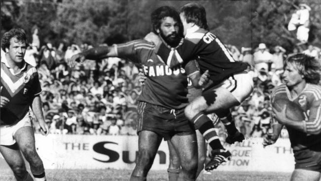 Arthur "Artie" Beetson is jumped by Easts player John Lang during the Parramatta v Eastern Suburbs game at Cumberland Oval, in this undated image. Picture: Warwick Lawson