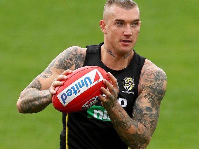 MELBOURNE, AUSTRALIA - DECEMBER 03: Dustin Martin of the Tigers runs with the ball during a Richmond Tigers AFL media opportunity at Punt Road Oval on December 03, 2018 in Melbourne, Australia. (Photo by Kelly Defina/Getty Images)