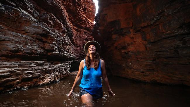 Bush radio DJ and festival events host Angie Ayers in Weano Gorge, Karijini National Park, in Western Australia. Picture: Colin Murty.