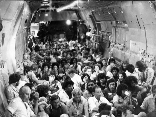 Tropical Cyclone Tracy, Darwin, Northern Territory. "This is what it is like to be evacuated. A total of 321 people sit on the floor a US Air Force Starlifter on a flight for Darwin to Sydney, 29 Dec 1974. (Pic by unidentified staff photographer)