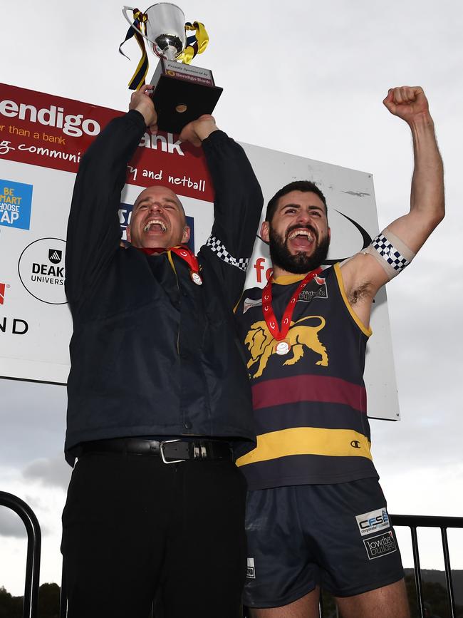 Nick Batsanis (right) celebrates a flag victory.