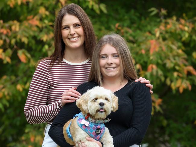 Taya, 16, talks about having endometriosis as the case study for new research into the debilitating condition that affects around one in nine women, causing severe period pain. Taya is pictured with her mother Nicole and their pet dog Marley. Picture: Ian Currie