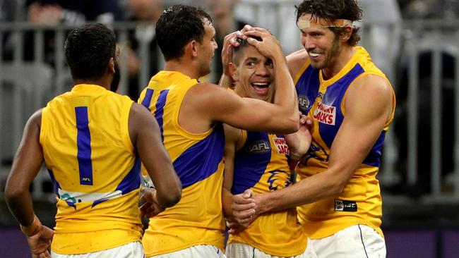 Jarrod Cameron is congratulated by teammates after one of his goals. Pic: AAP