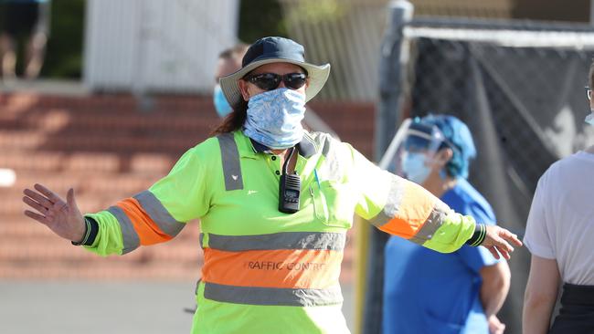 Crowd control at the vaccine hub at Doomben racecourse. Photo: Annette Dew